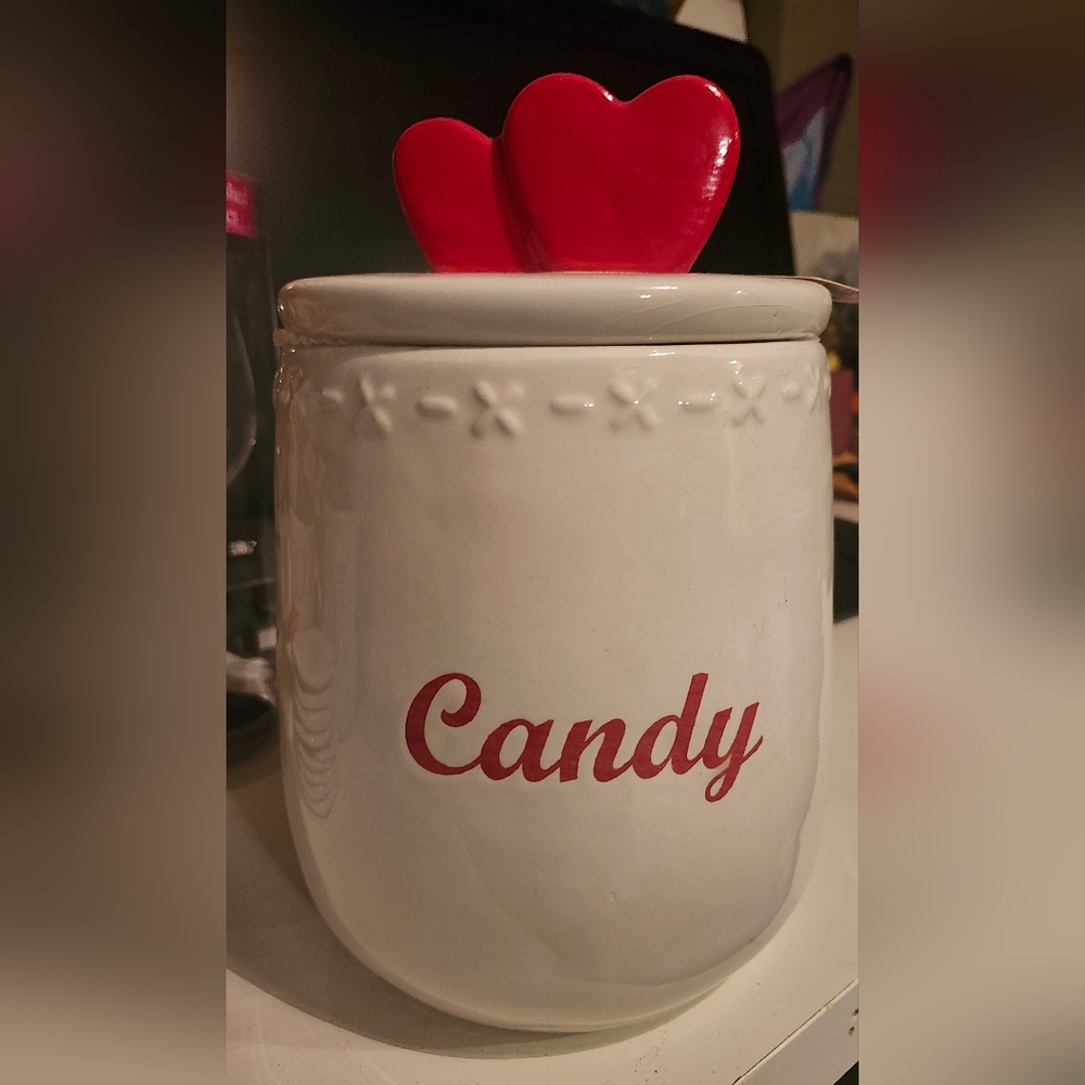 White and red glass candy jar.